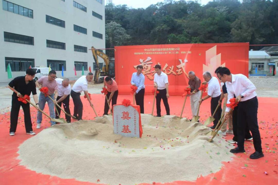 Groundbreaking ceremony for TCB Bearing Phase II project, guests turning the first shovels of earth